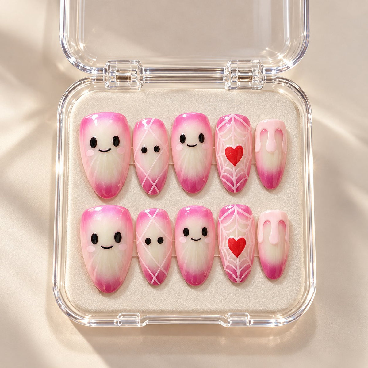 Pink Aurora Halloween Ghost Press On Nails With Web and Heart Details in clear acrylic storage box