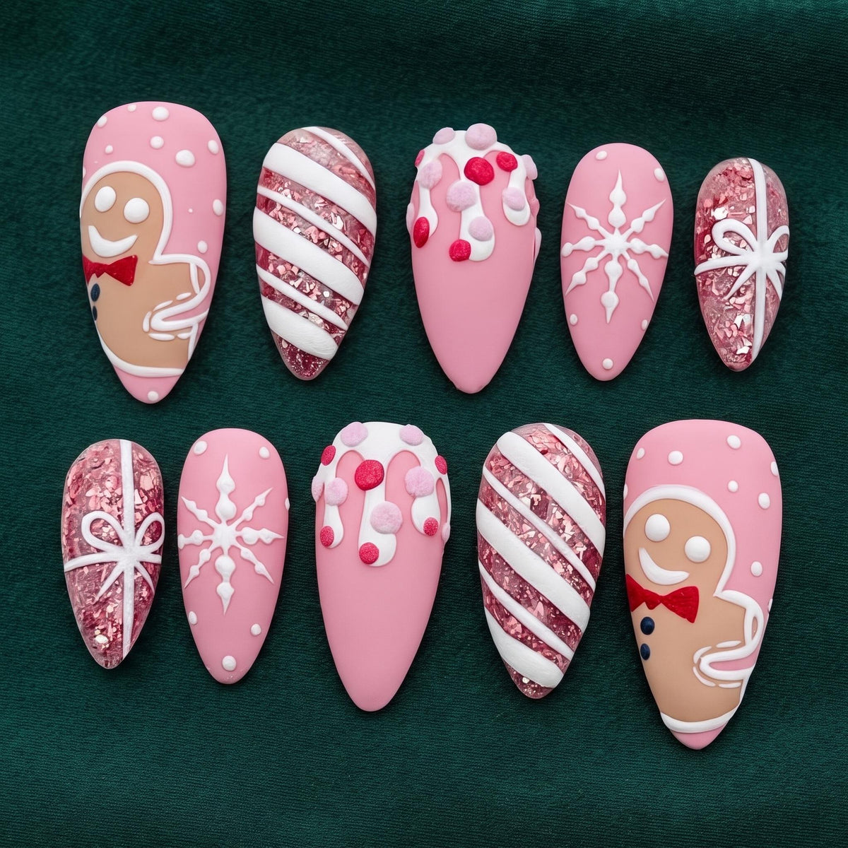 Pink Christmas Nails With Gingerbread, Snowflakes, Candy Stripes, and Glitter Bows