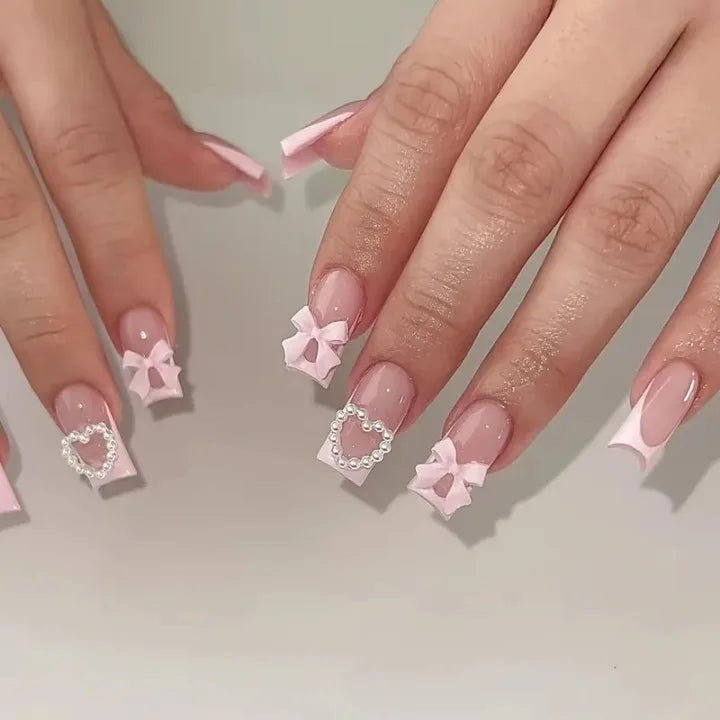 Pink French Tip Press-On Nails with Raised Bows and Pearl-Outlined Hearts