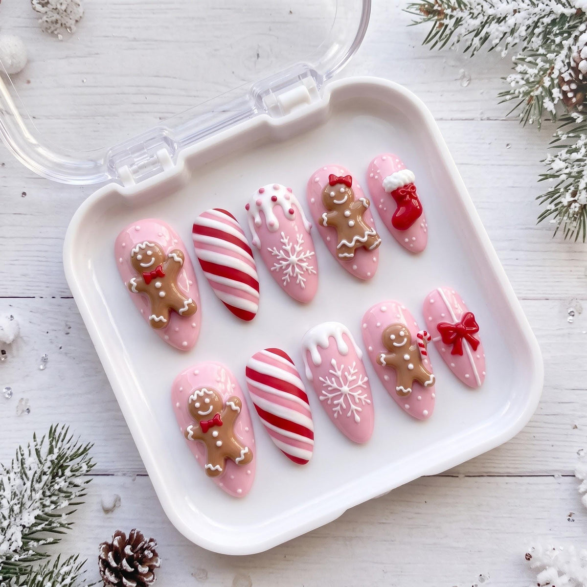 Pink Gingerbread Christmas Nails With Candy Cane Stripes, Snowflakes, Stockings and Bows