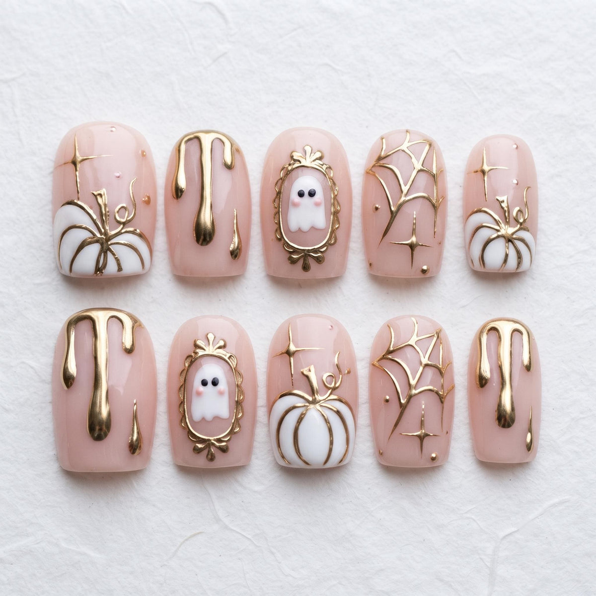 Pink Halloween Press-On Nails With Gold Ghosts, Pumpkins and Chrome Accents