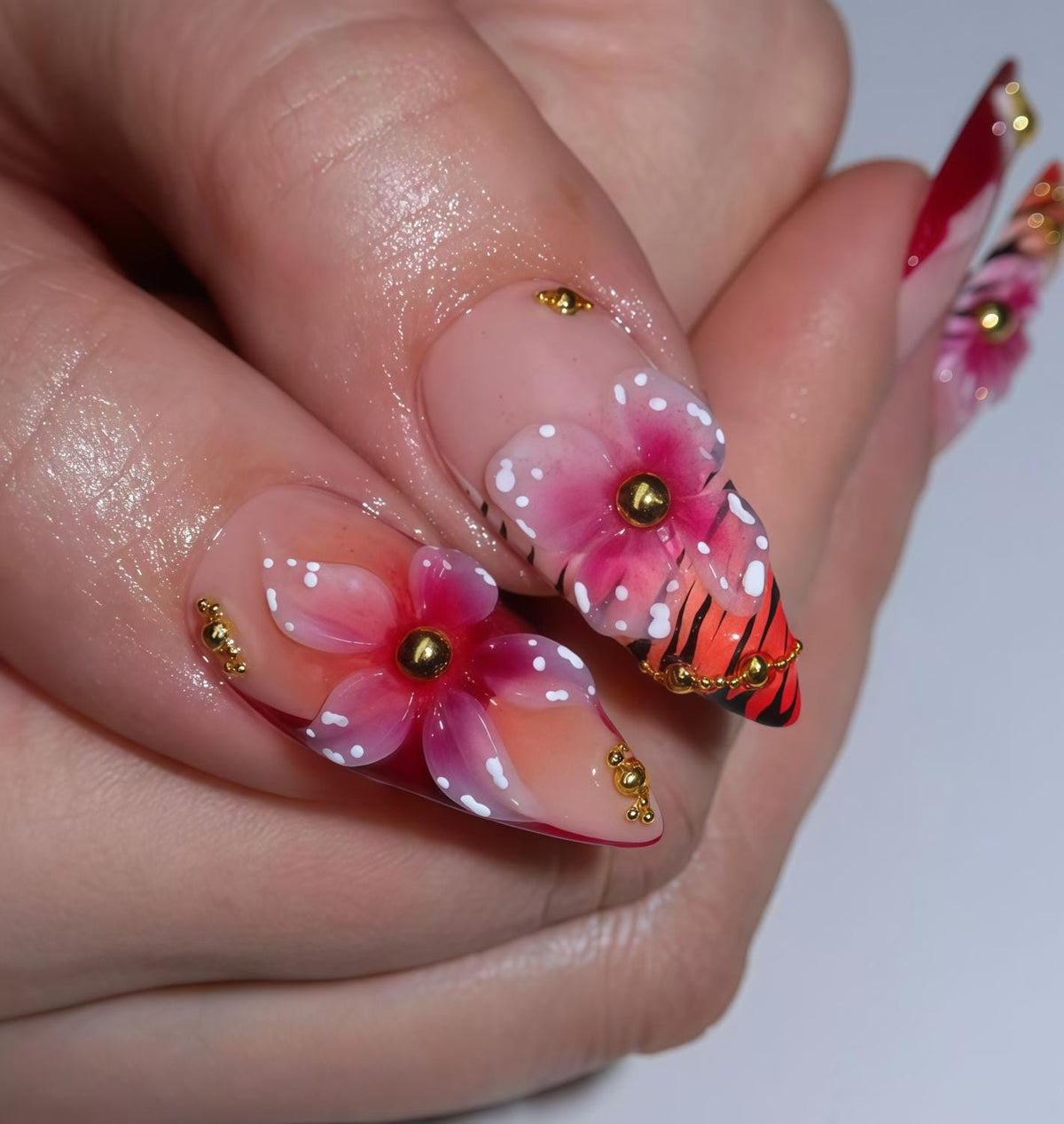 Pink Tropical Flower Press-On Nails With Red Tips and Gold Chain Details