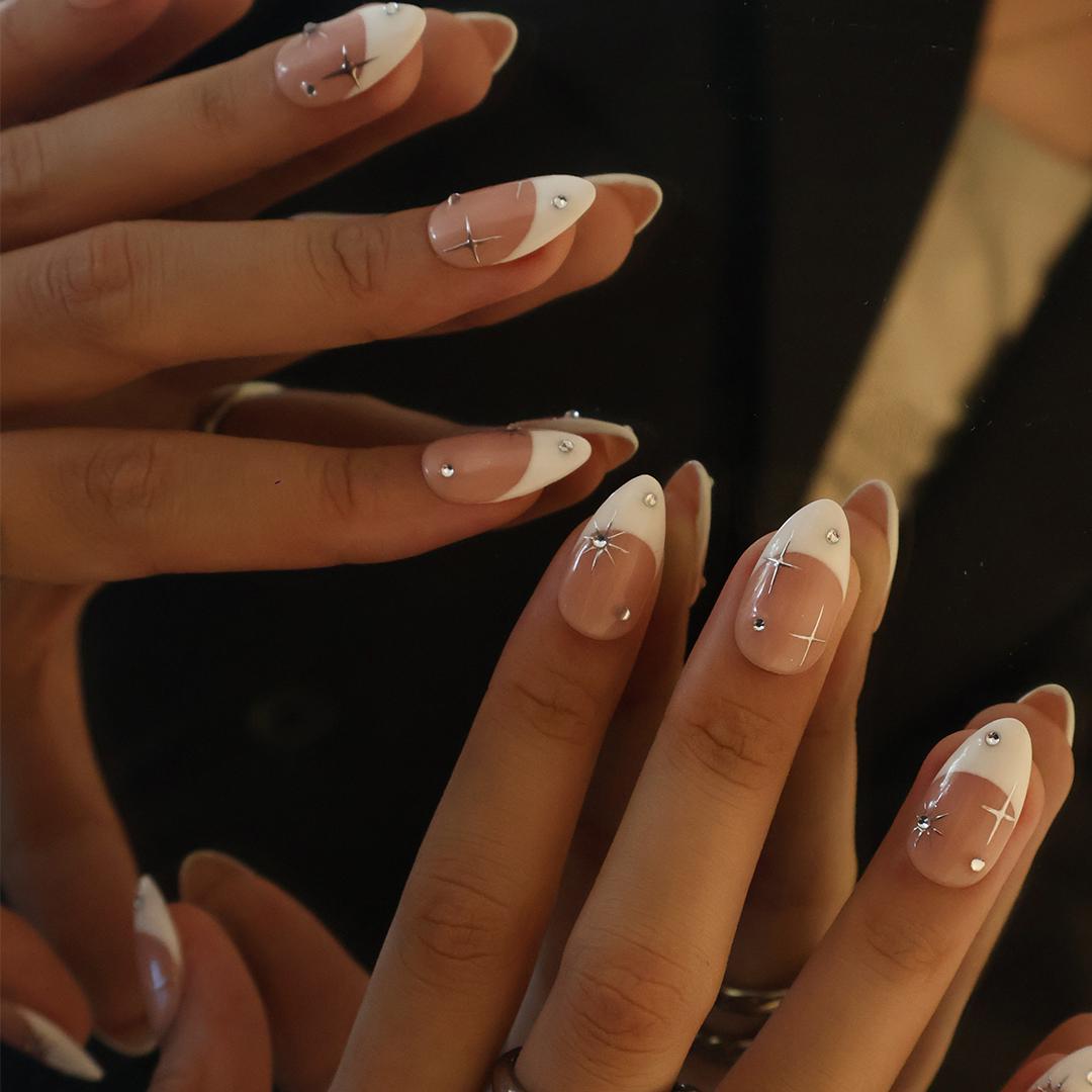 Blush Pink French Tip Nails with Silver Stars and Rhinestone Accents