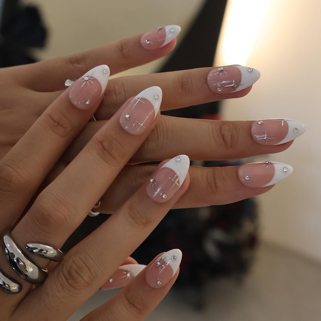 Blush Pink French Tip Nails with Silver Stars and Rhinestone Accents