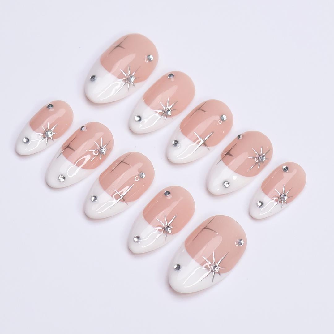 Blush Pink French Tip Nails with Silver Stars and Rhinestone Accents