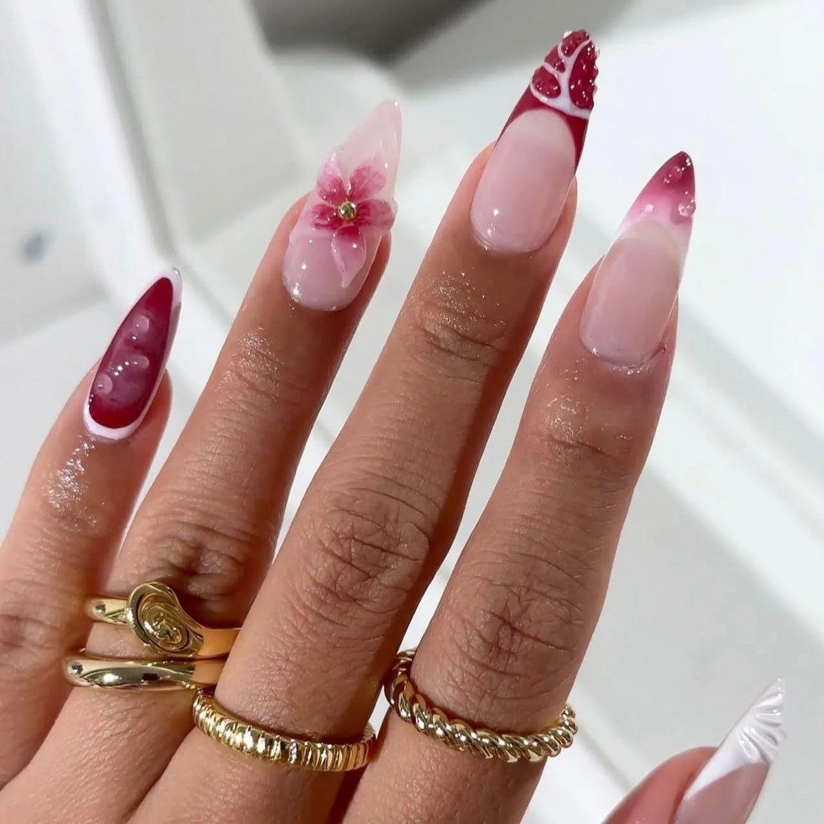 Red and Burgundy French Tip Nails with Pink Floral Accent