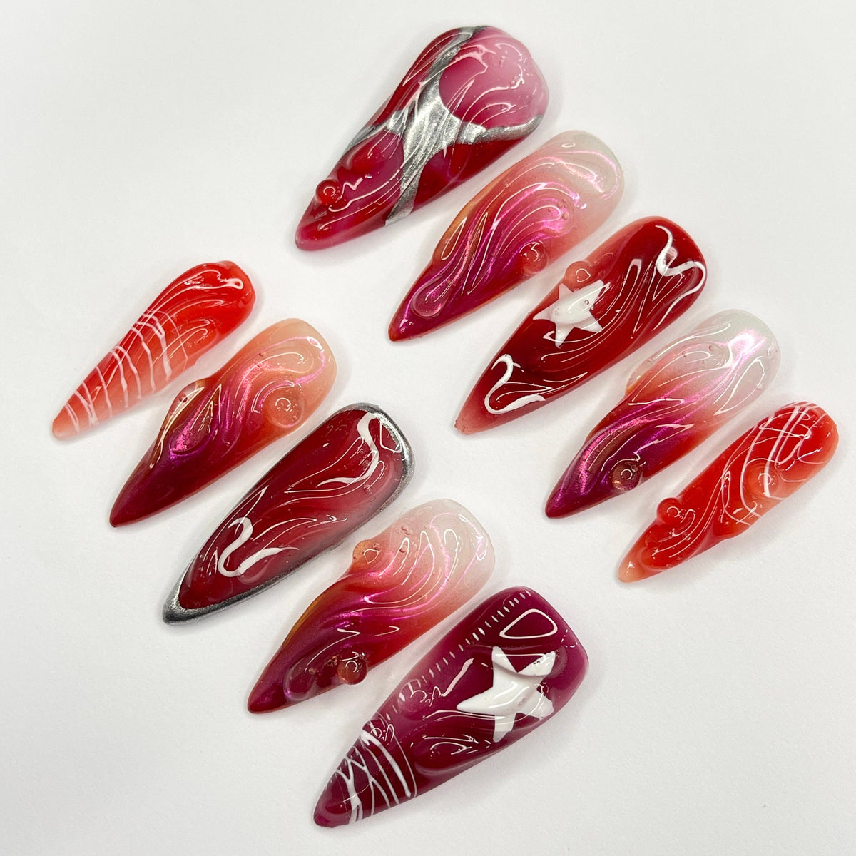Red and Burgundy Swirl Press On Nails With White Star Charms and Silver Accents
