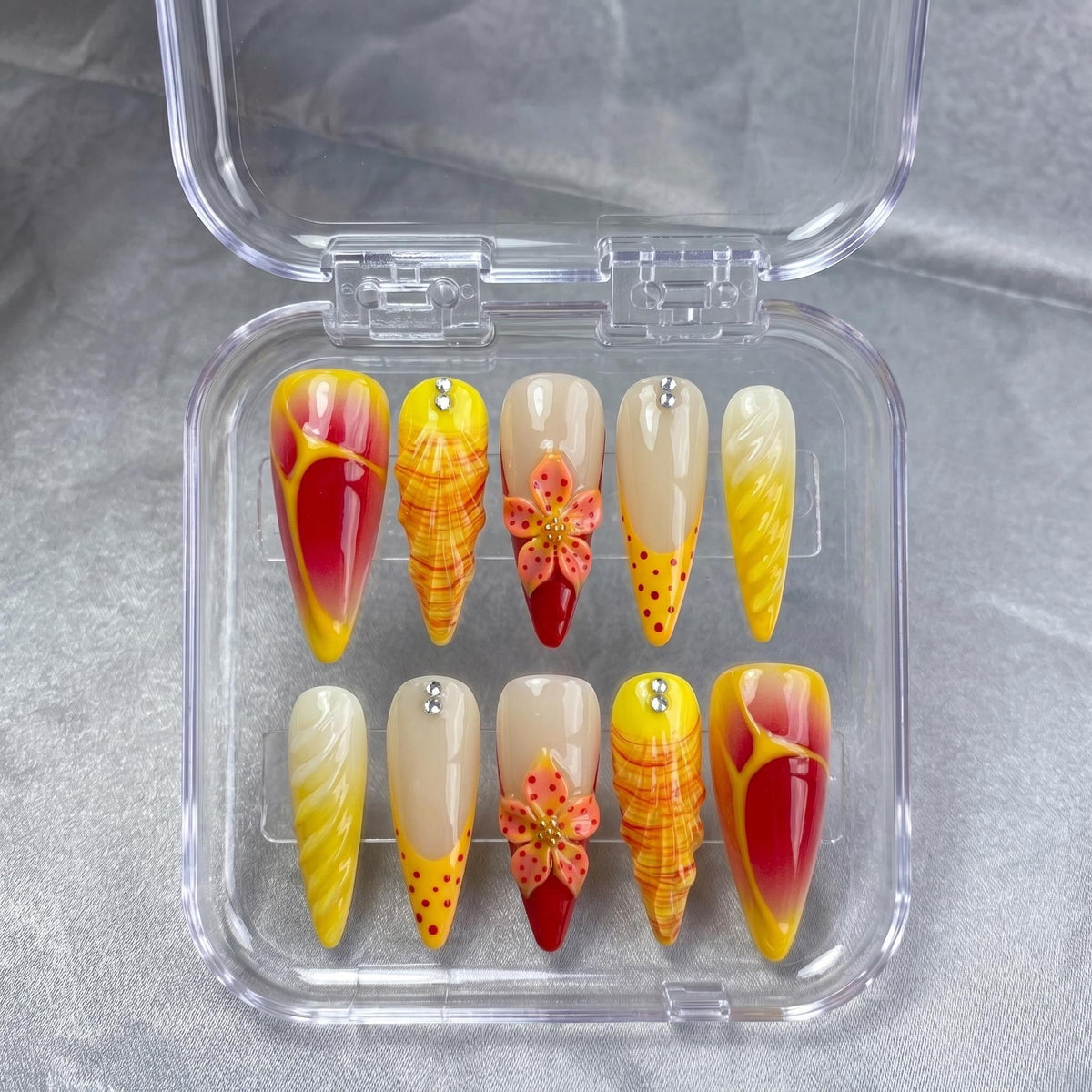 Red and Yellow Summer Tropical Flower Press-On Nails with Plaid, Marble, and Rhinestone Details