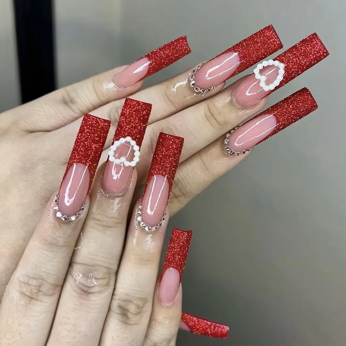 Red Glitter French Tip Nails with White Raised Heart Outlines and Rhinestones