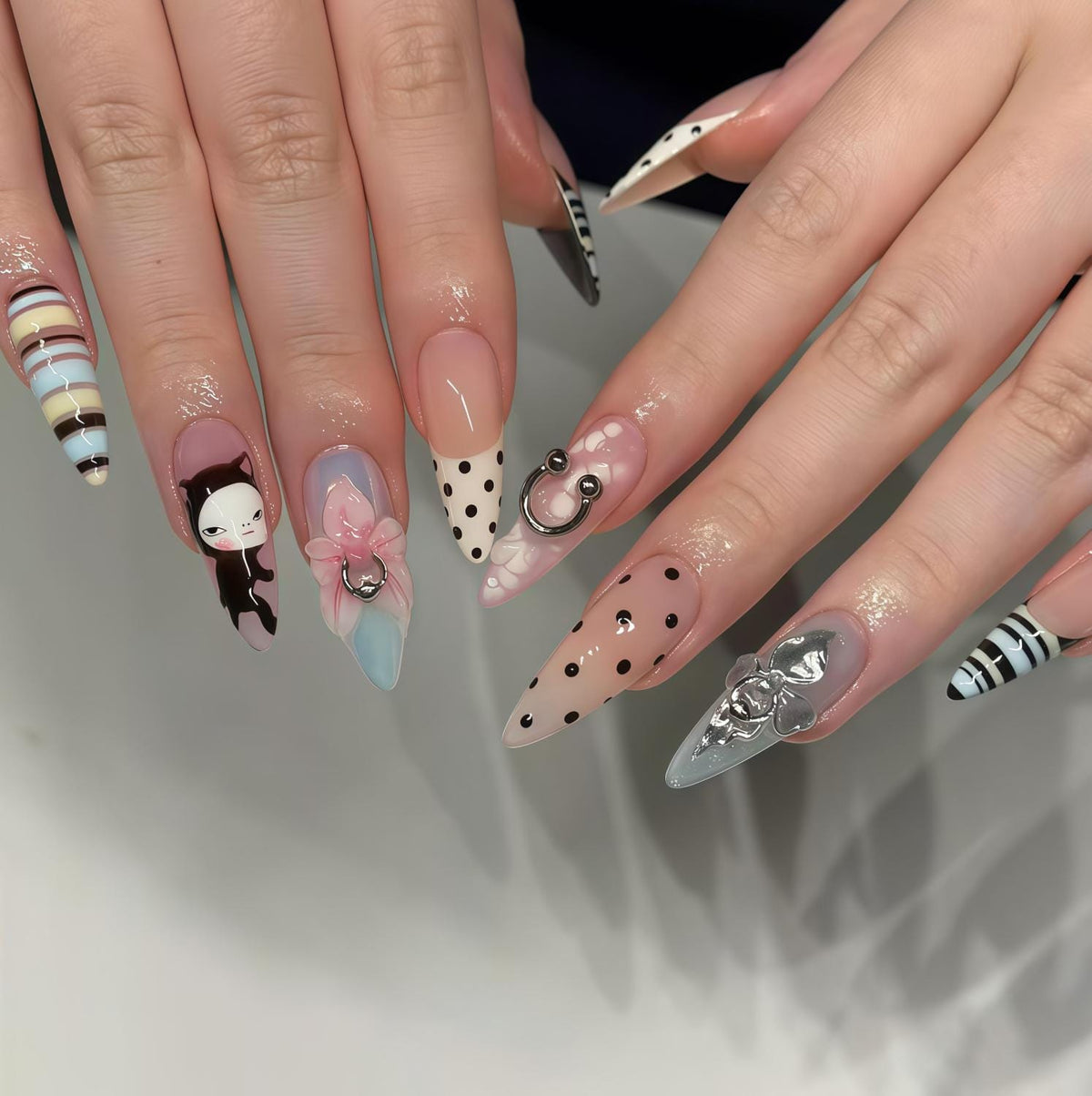 Retro Cat Nail Set With Polka Dots, Stripes, Pink Bow, and Metallic Charms