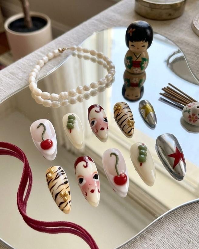 Retro Cherry and Tiger-Stripe Press On Nails with Chrome Stars and Illustrated Faces