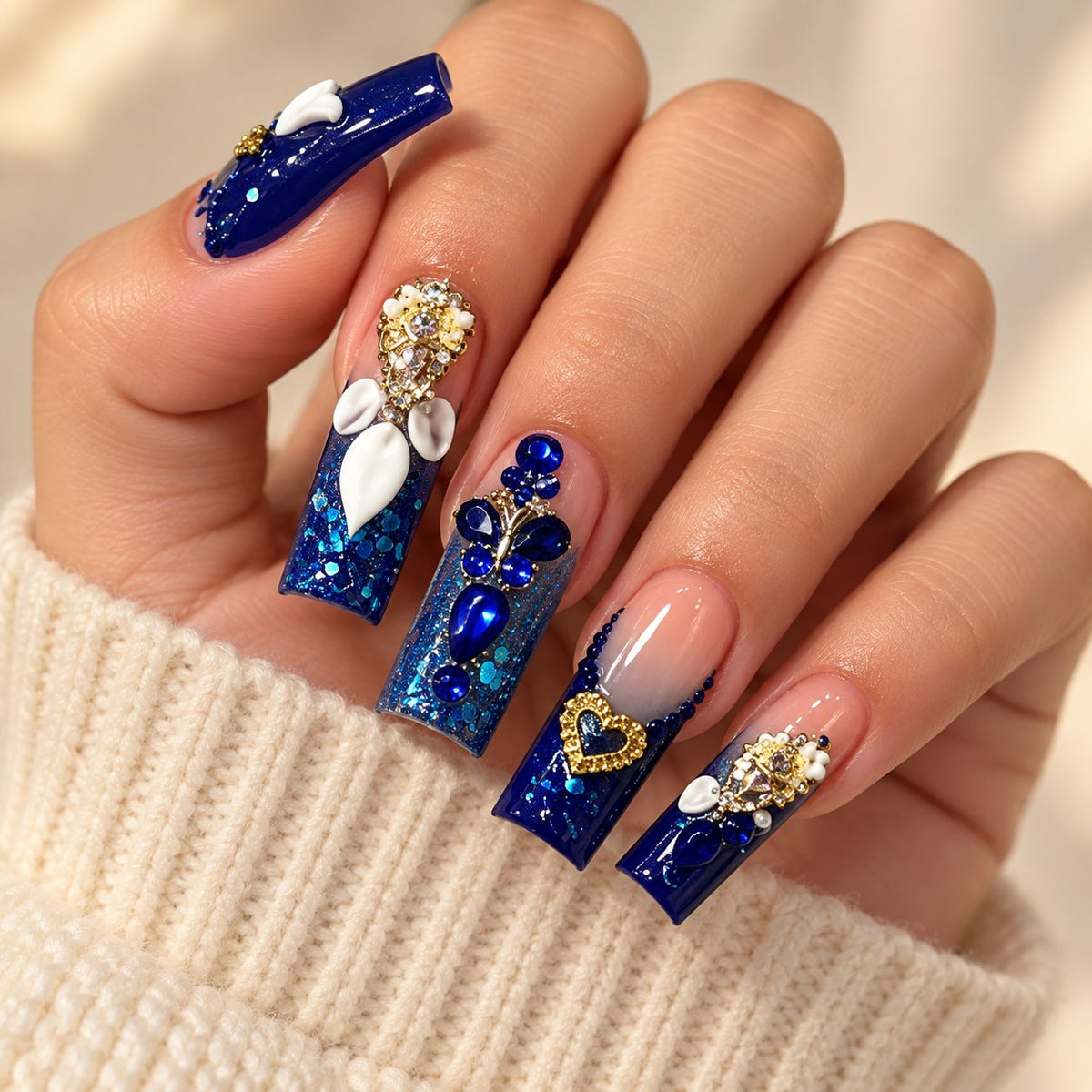 Royal Blue 3D Heart Rhinestone Press-On Nail Set worn on hand