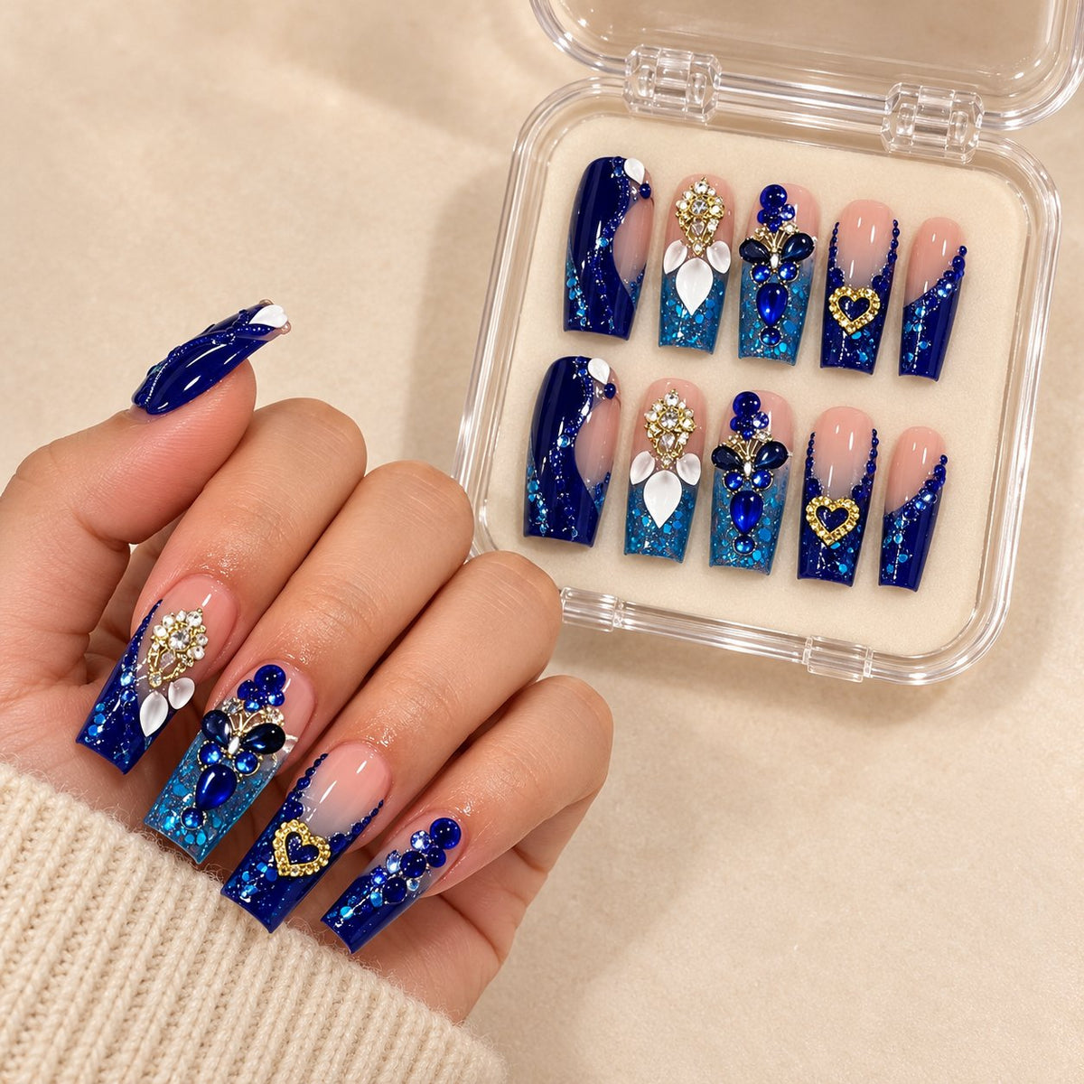 Royal Blue 3D Heart Rhinestone Press-On Nail Set worn on hand with acrylic storage box