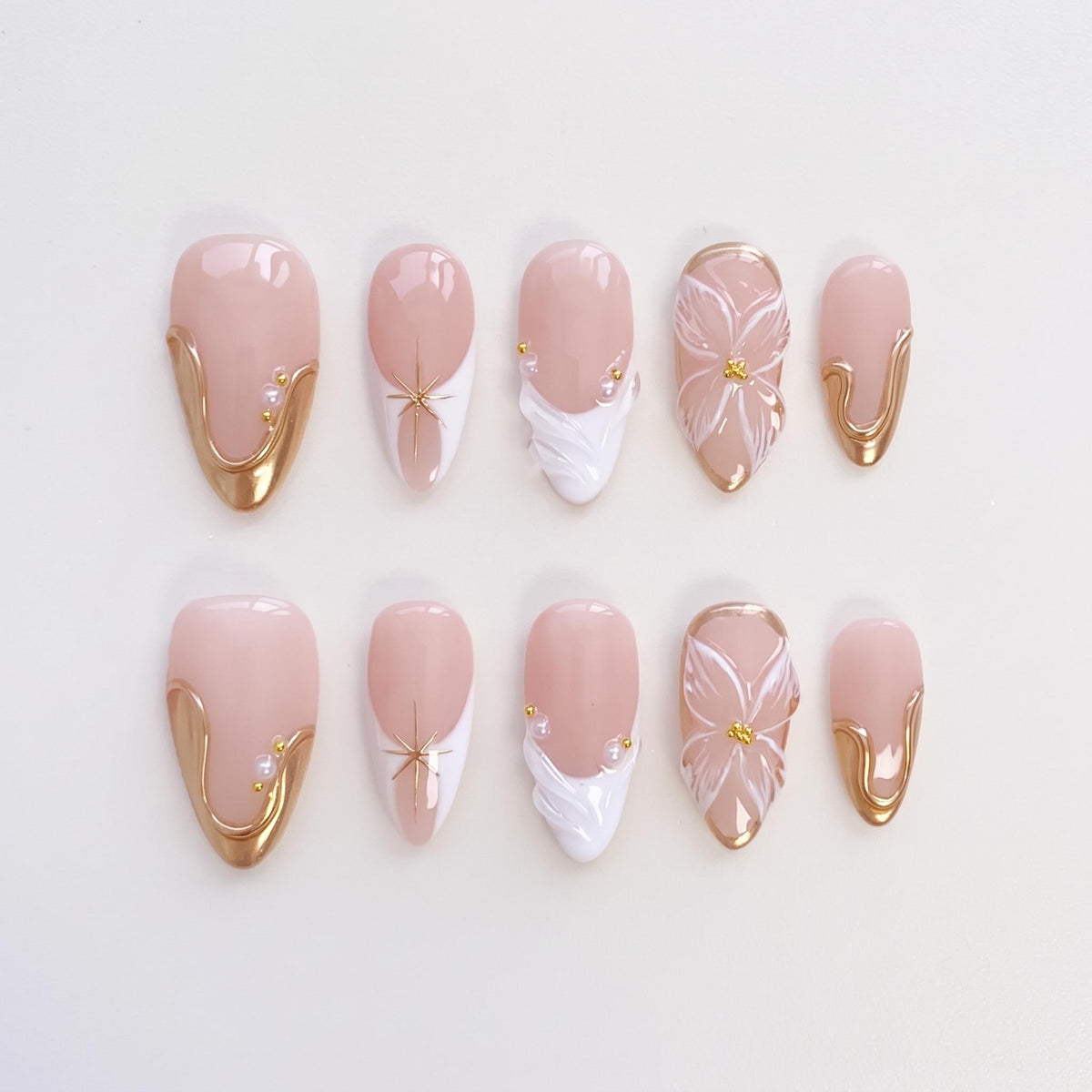 Sheer Blush Pink Bridal Nails With White Flowers, Gold Swirls and Raised Details