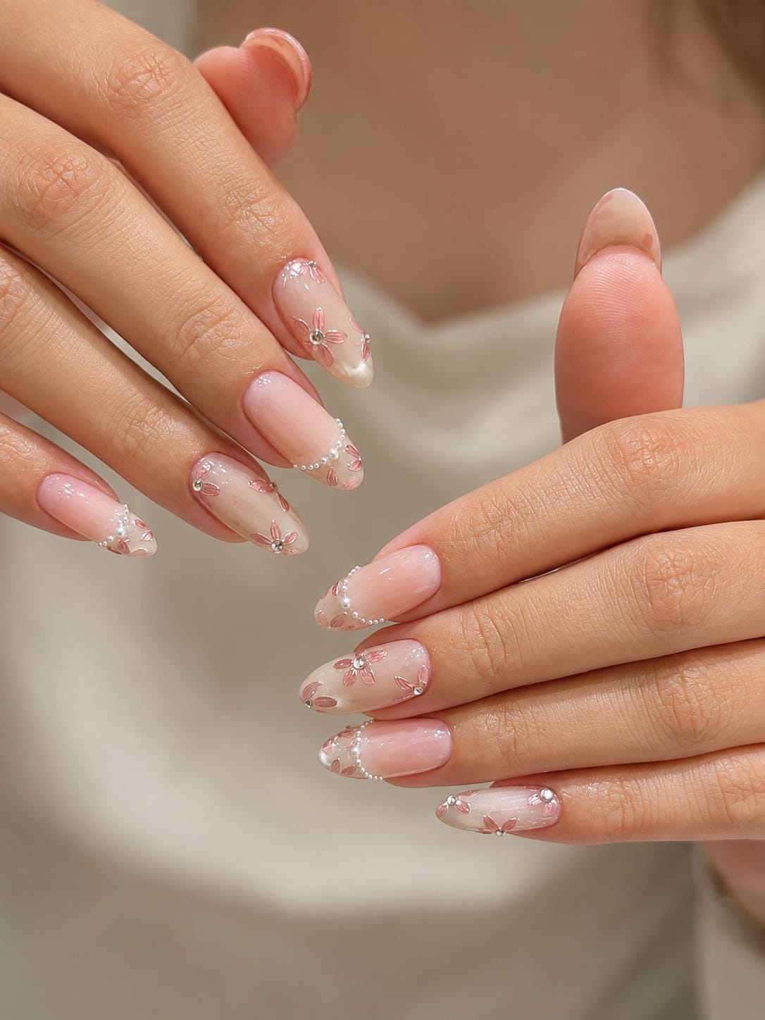 Sheer Nude Pink Floral French Tip Nail Set With Gold and Iridescent Accents
