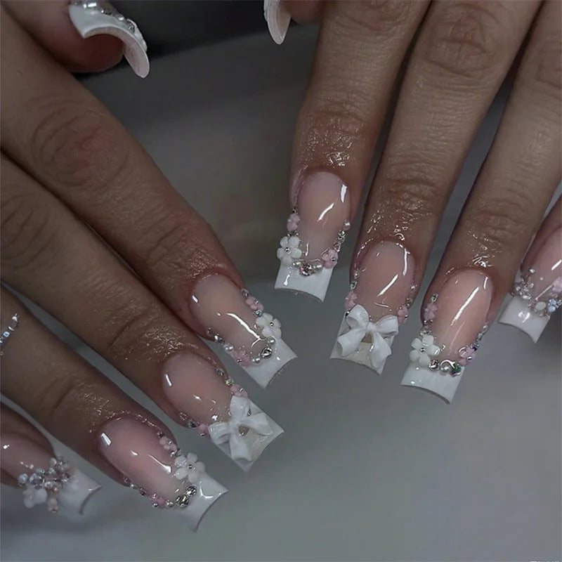 Sheer Nude Pink French Tip Nails with 3D White Bows, Flowers and Pearls