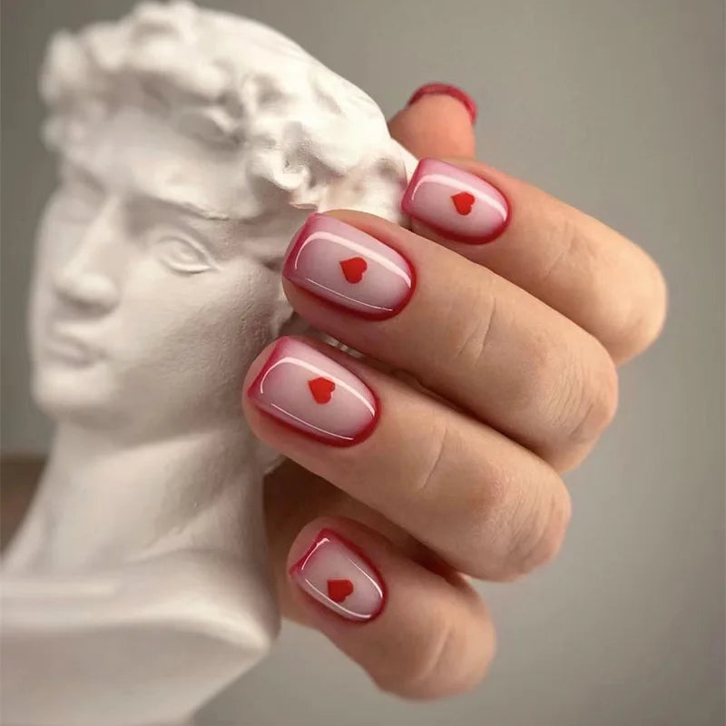 Sheer Nude Pink Nails With Red Heart French Tips