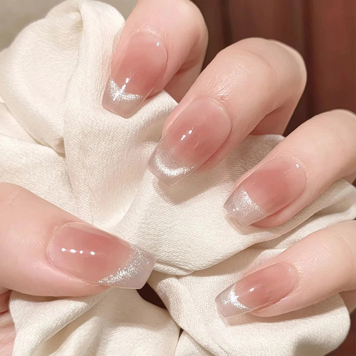 Sheer Nude-Pink Nails With Silver Glitter French Tips