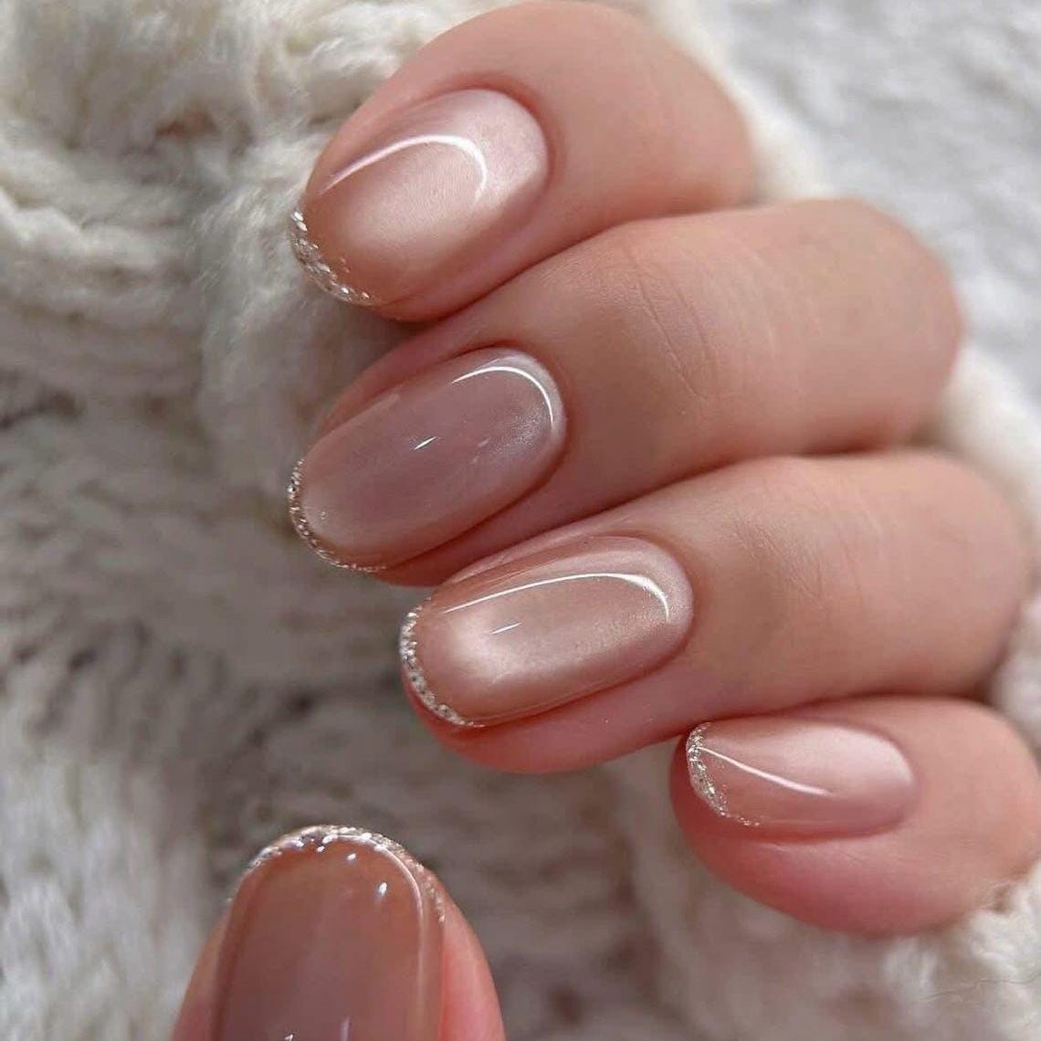 Sheer Nude Pink Nails with Subtle Silver Glitter French Tips