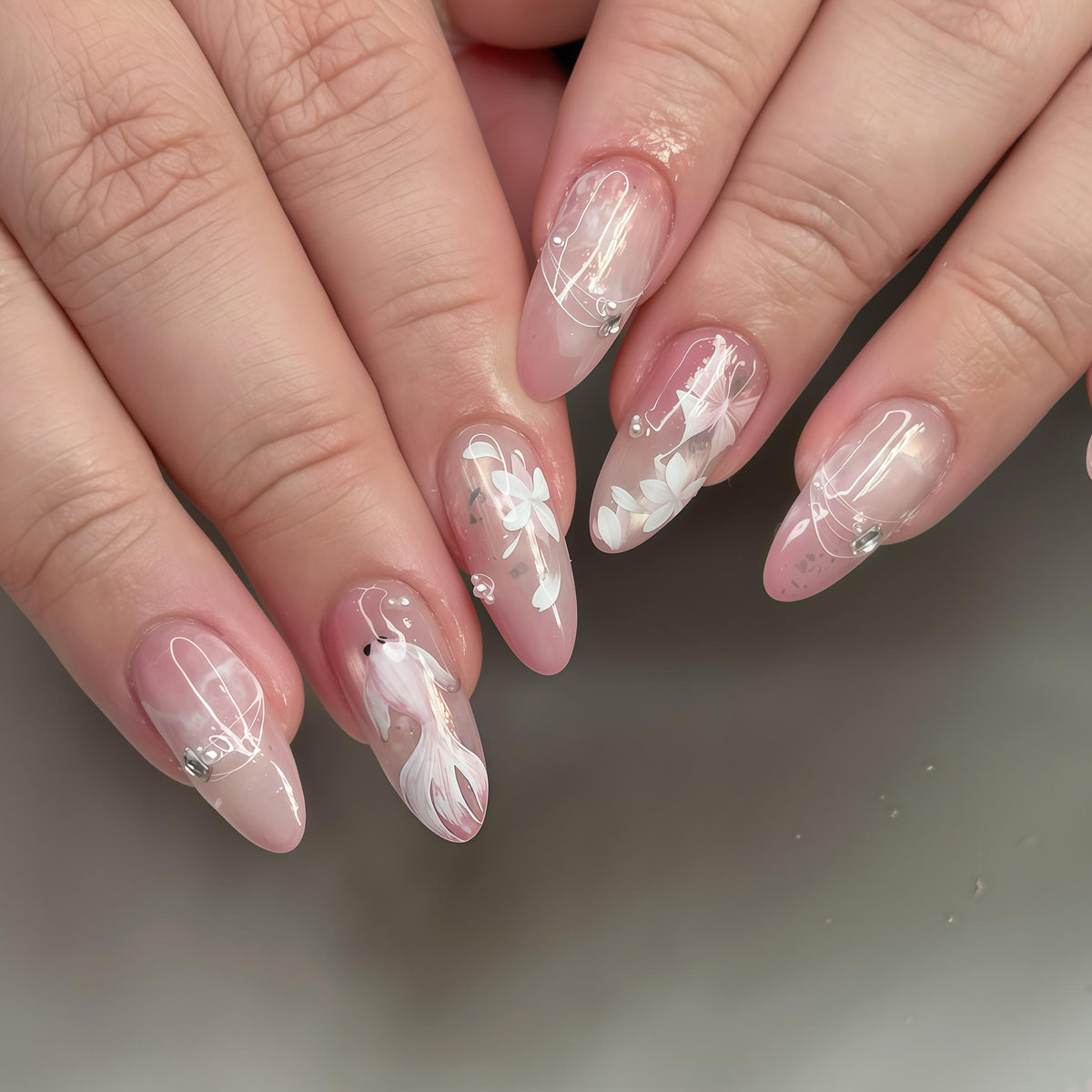 Sheer Pink Floral Press-On Nails with White Flowers and Silver Accents