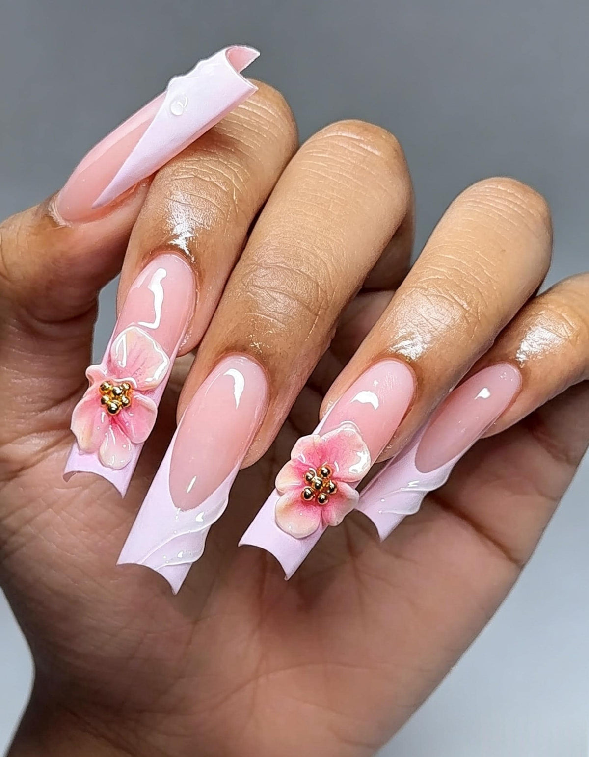 Sheer Pink French Tip Nails With 3D Flowers and Gold Bead Centers