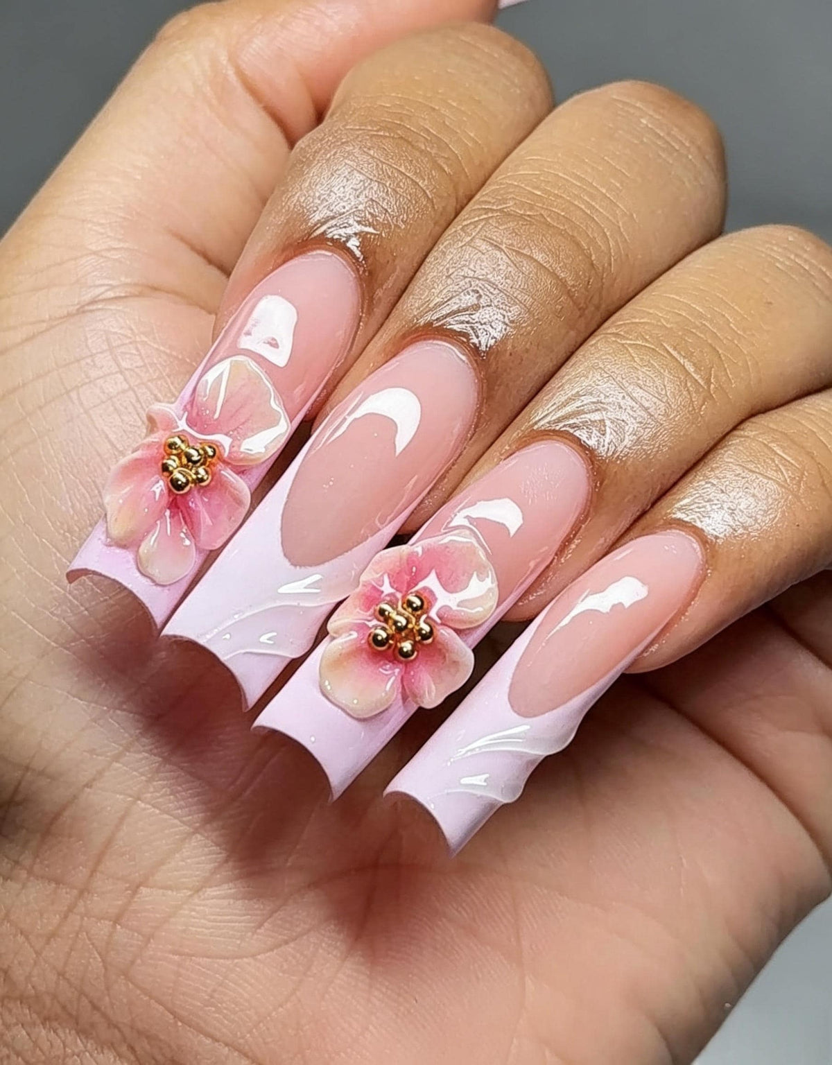 Sheer Pink French Tip Nails With 3D Flowers and Gold Bead Centers