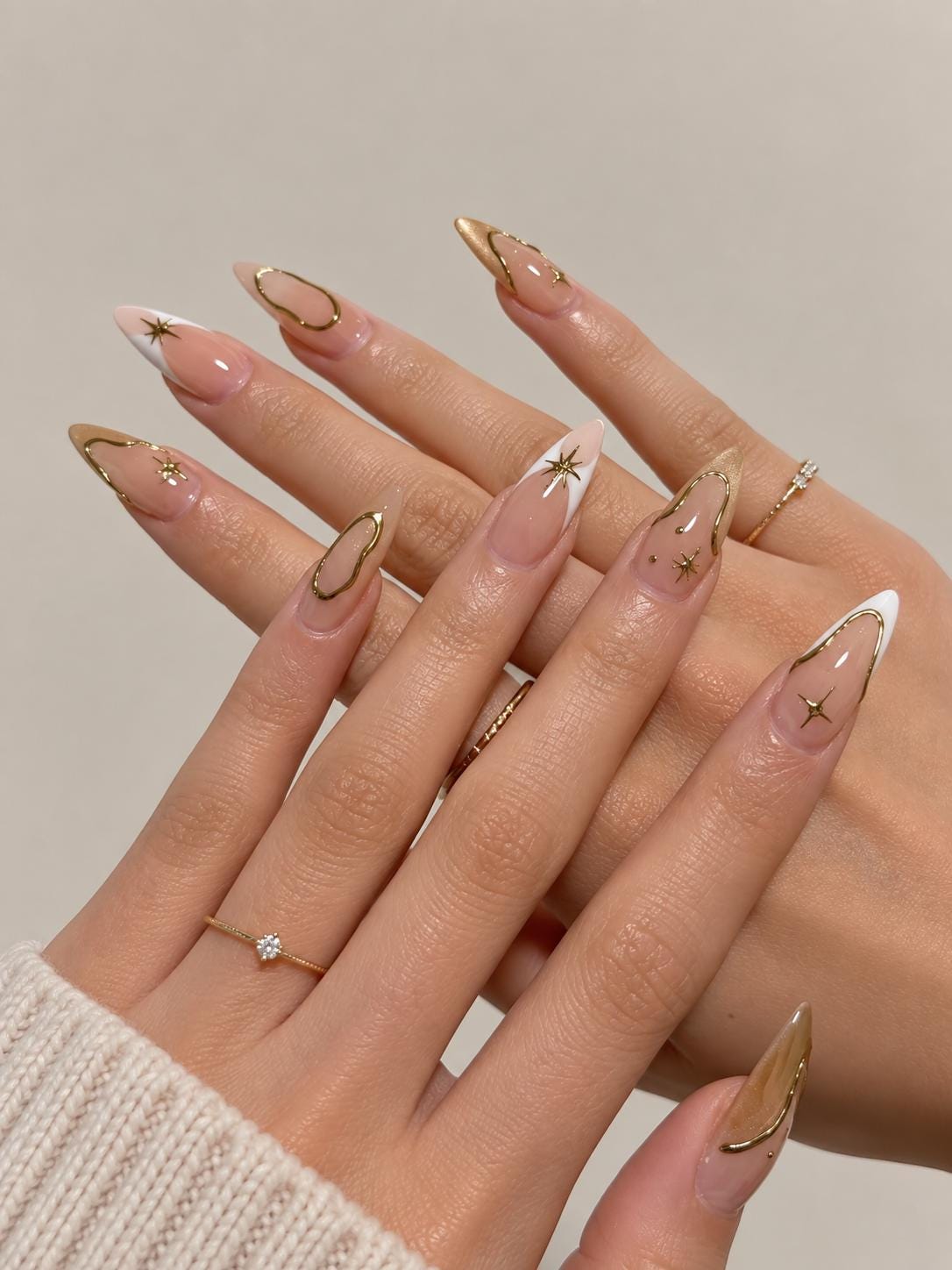 Sheer Pink French Tip Nails with Gold Celestial Accents