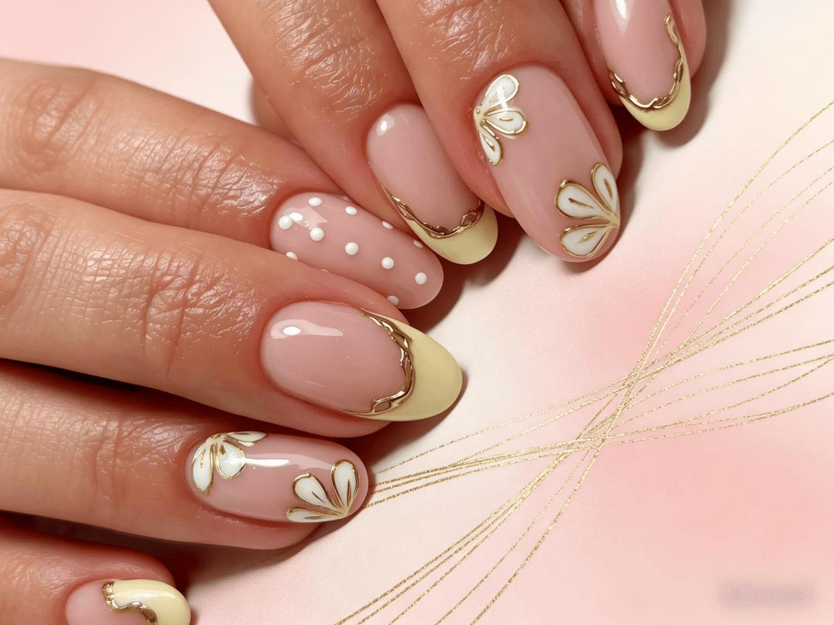 Sheer Pink French Tip Nails with Gold Edging and White Floral Details