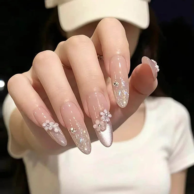 Sheer Pink Glitter French Tip Nails With Raised White Flowers