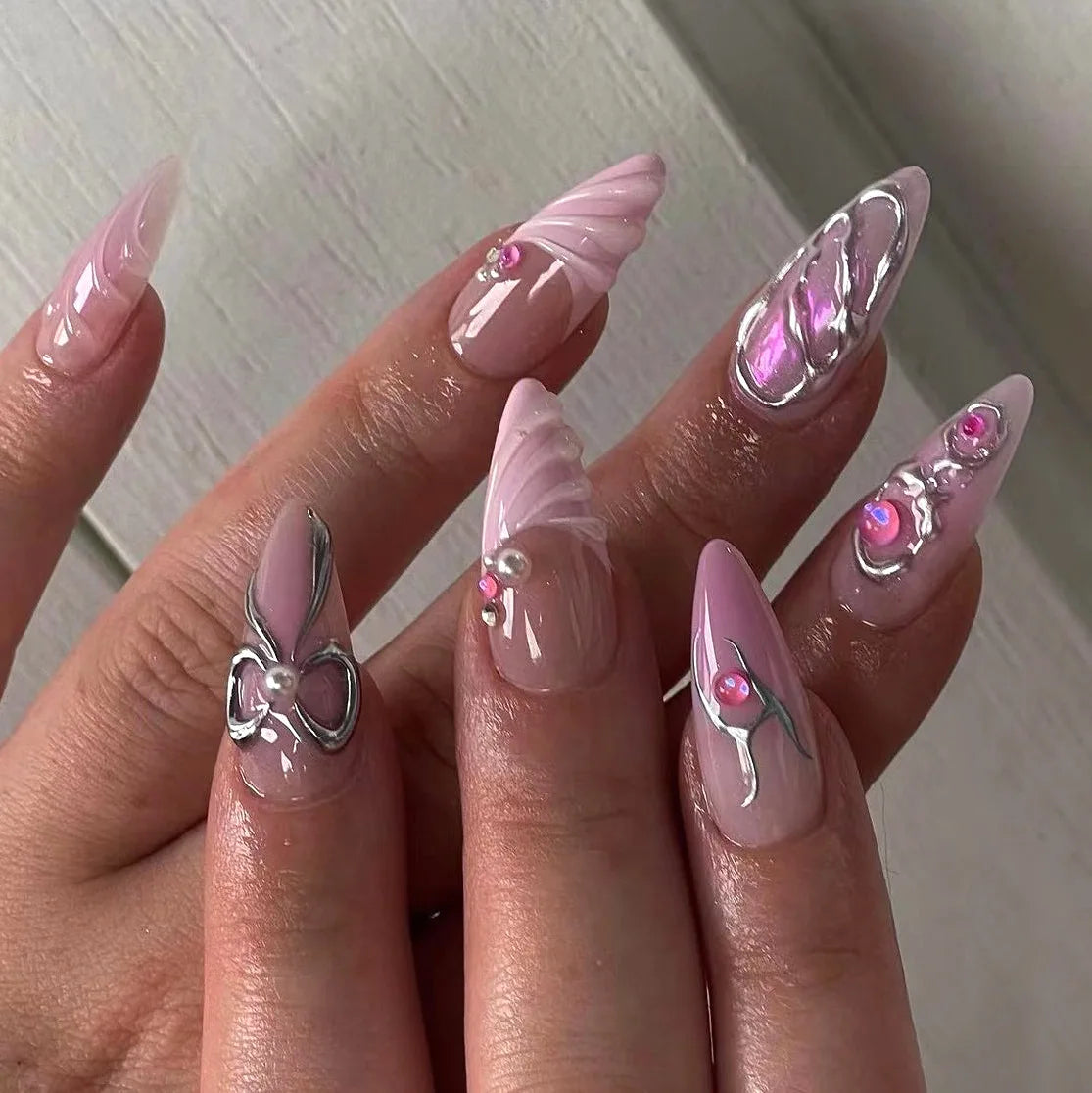 Sheer Pink Nails with Silver Chrome Swirls, Bows and Rhinestones