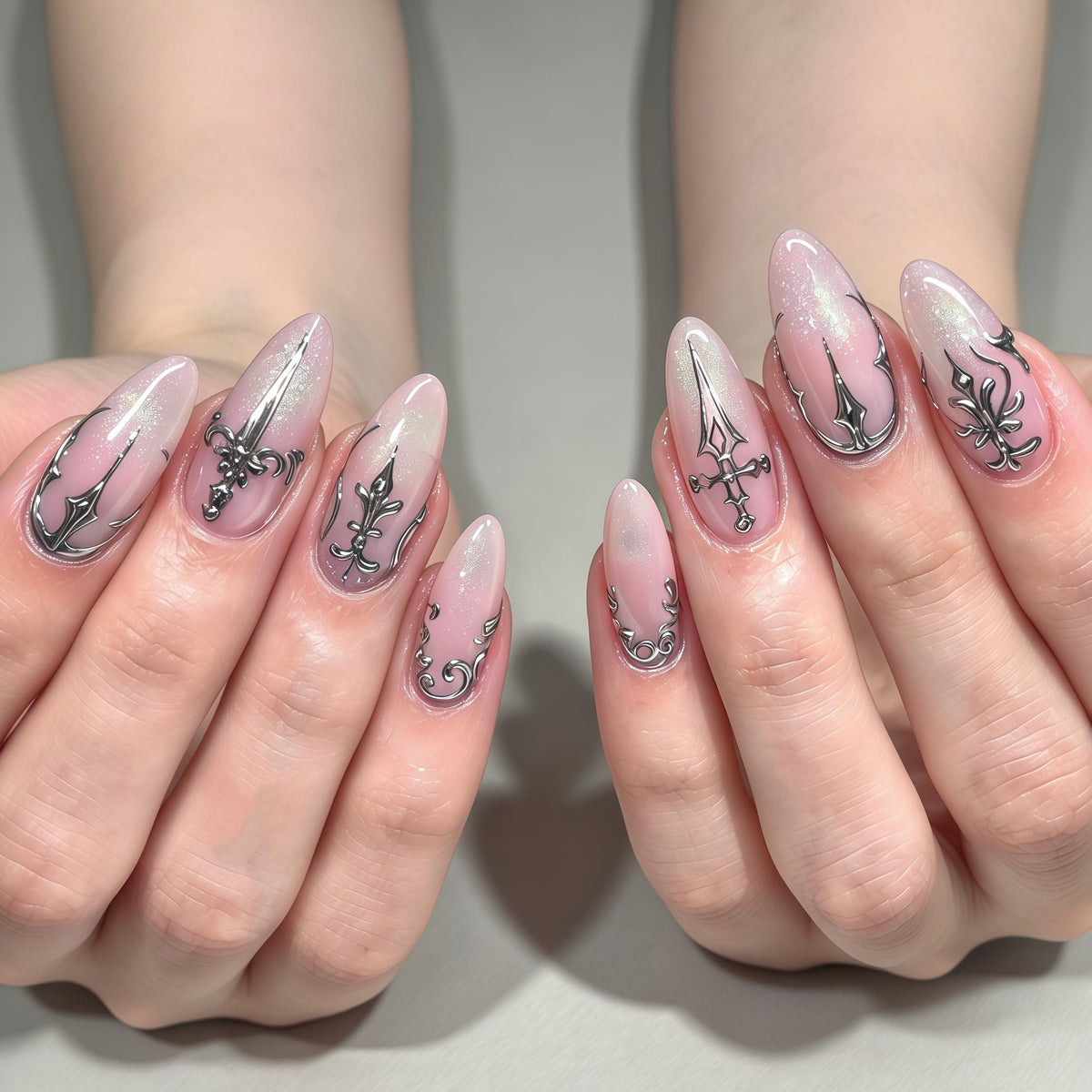 Sheer Pink Shimmer Nails With Silver Gothic Sword Designs