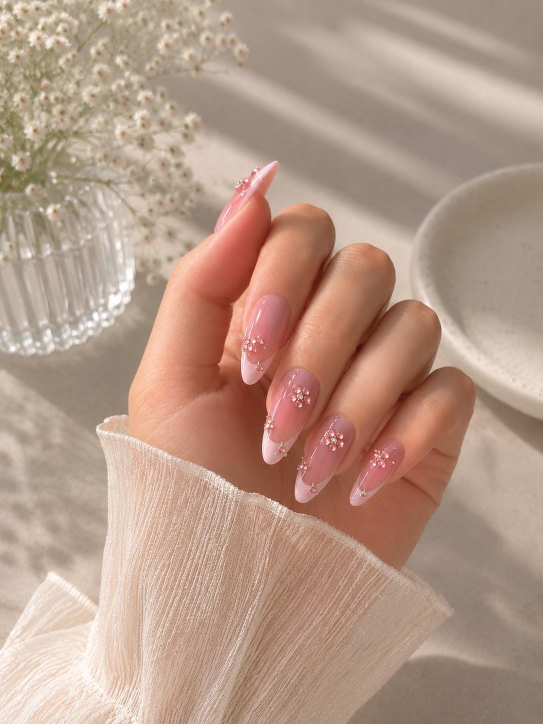 Sheer Rosy Pink Nails with Flower-Like Rhinestone Clusters