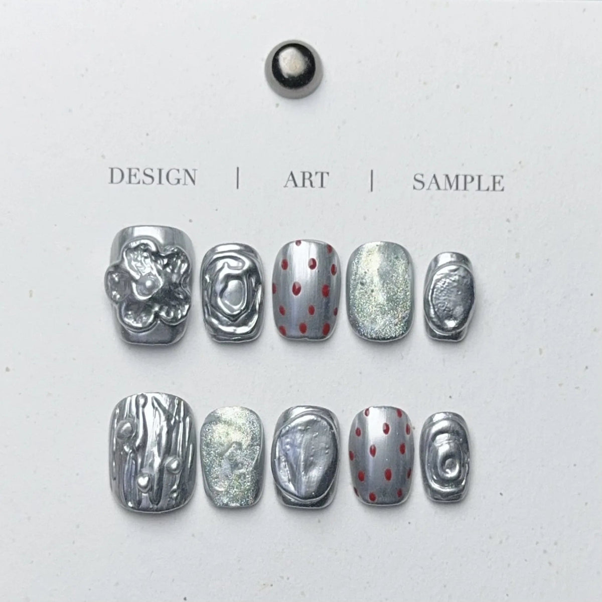 Silver Chrome Relief Nails With Glitter and Red Dots