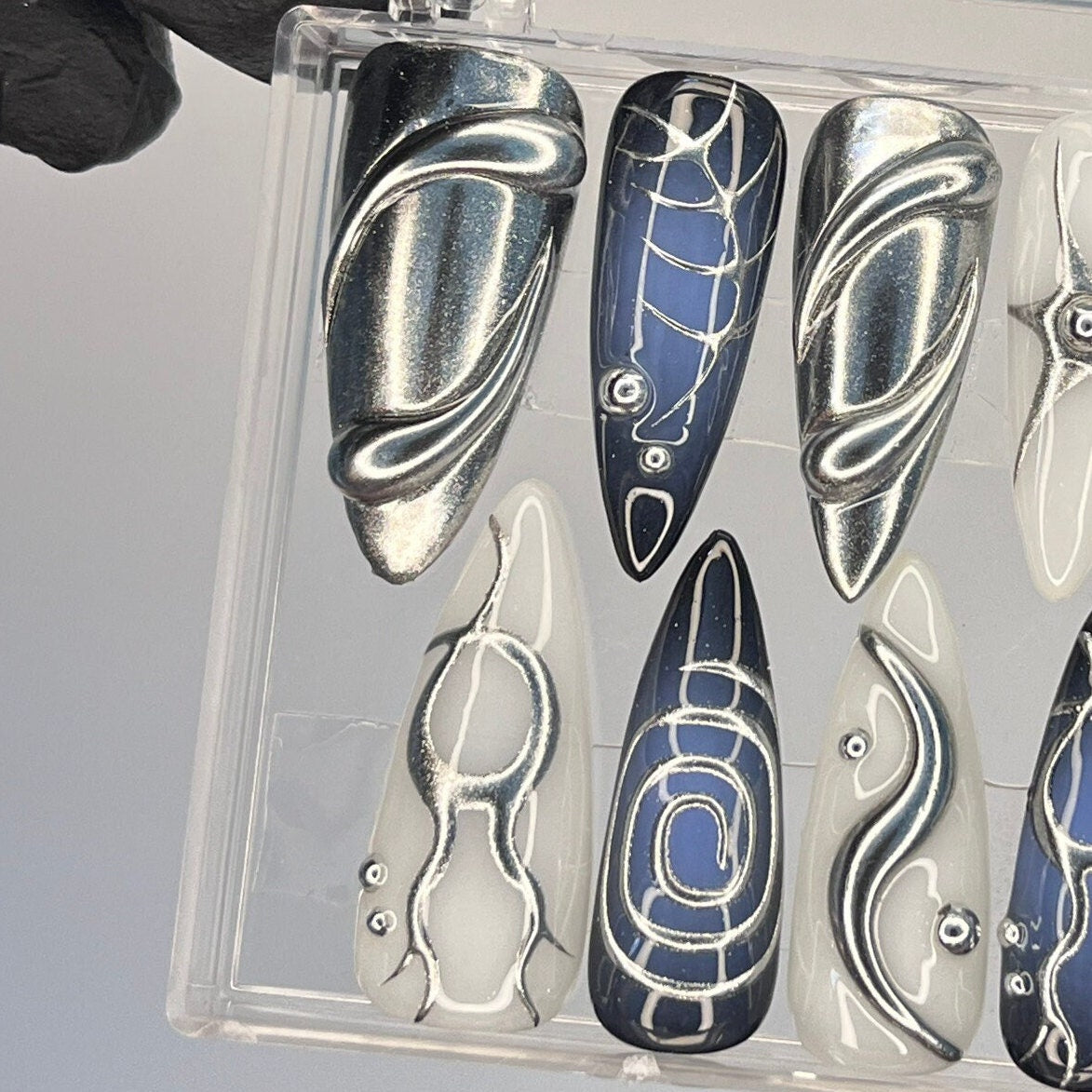 Silver, Navy, and Ivory Y2K Chrome Swirl Nail Set With Metallic Accents
