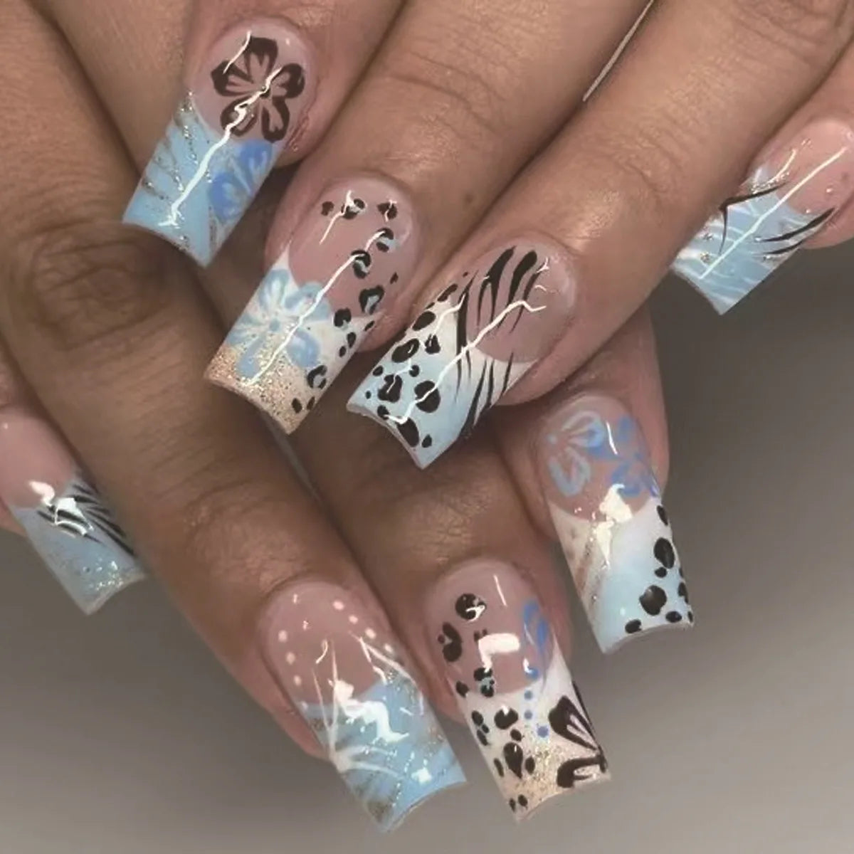 Sky Blue and Nude Leopard French Tip Nail Set with Floral Details