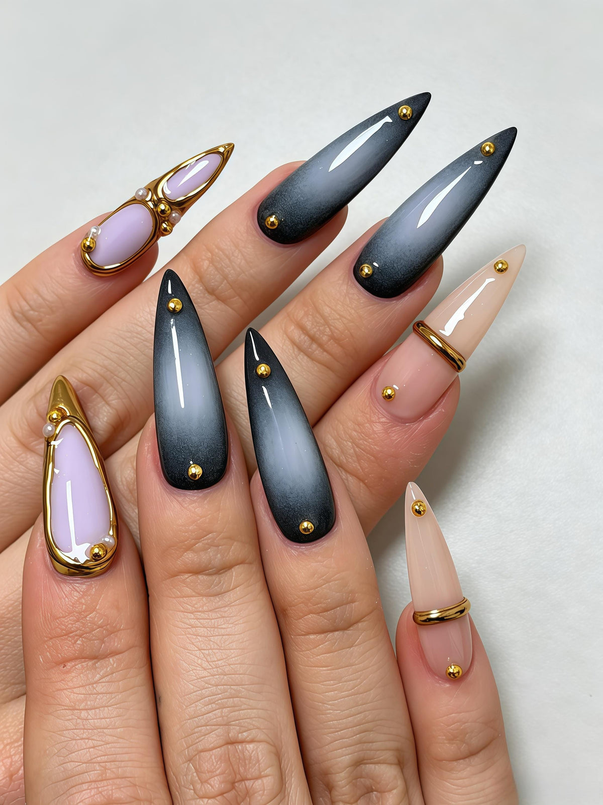 Smoky Charcoal Gradient Nails with Lavender Accents and Gold Studs