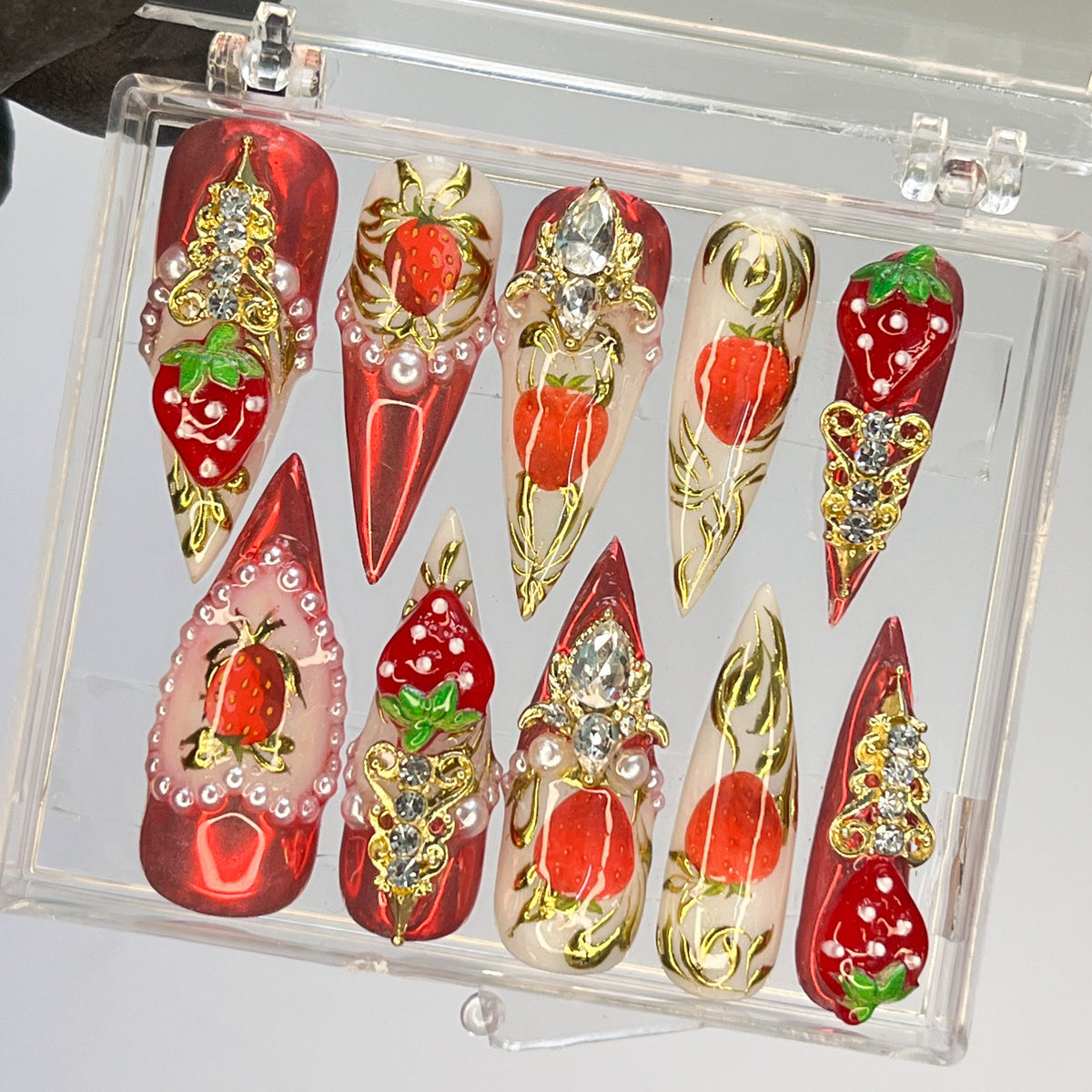 Strawberry Press-On Nail Set With Gold Embellishments and Rhinestones