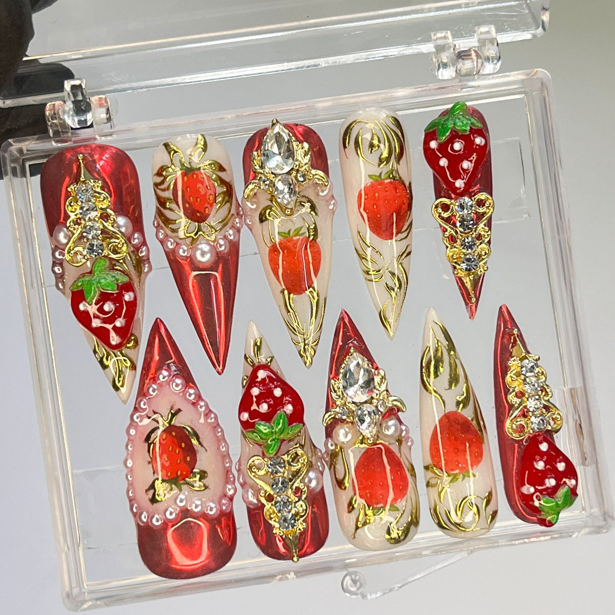 Strawberry Press-On Nail Set With Gold Embellishments and Rhinestones