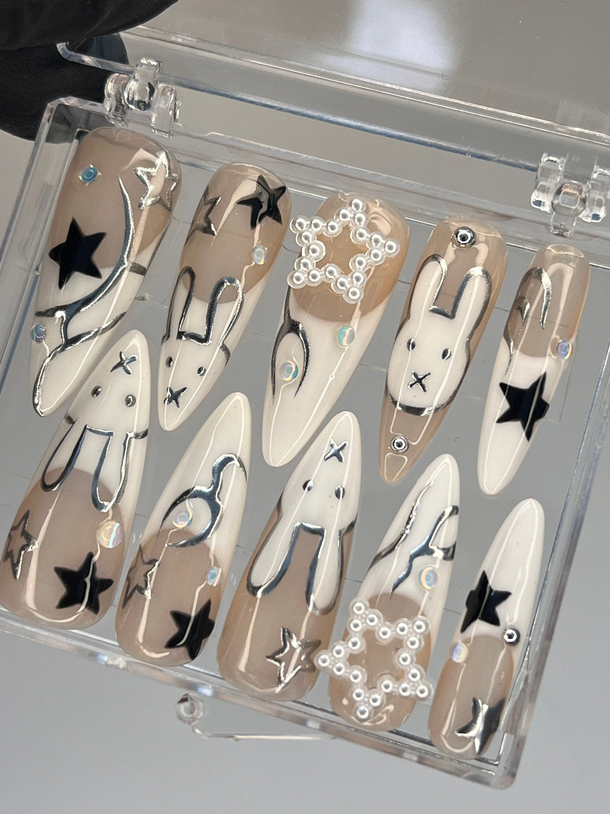 Taupe and White Star & Rabbit Nails With Pearl Clusters