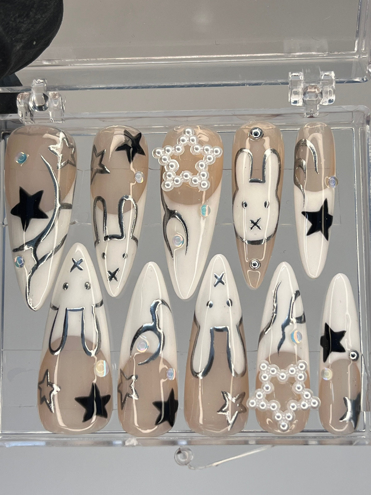 Taupe and White Star & Rabbit Nails With Pearl Clusters