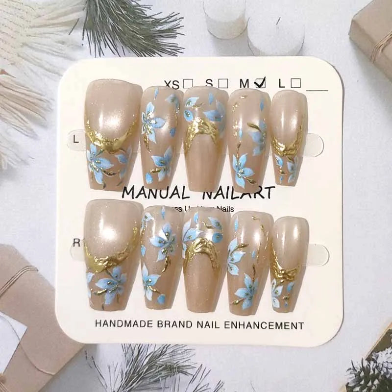 Taupe Cat-Eye Nails with Pale Blue Flowers and Gold Accents