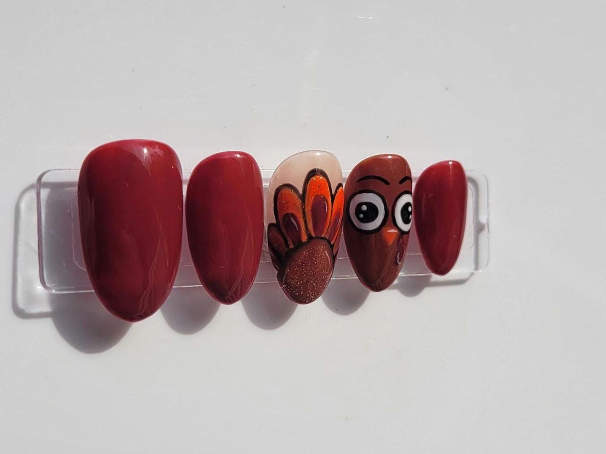 Thanksgiving Turkey Nails in Glossy Maroon with Painted Feather and Face Accents