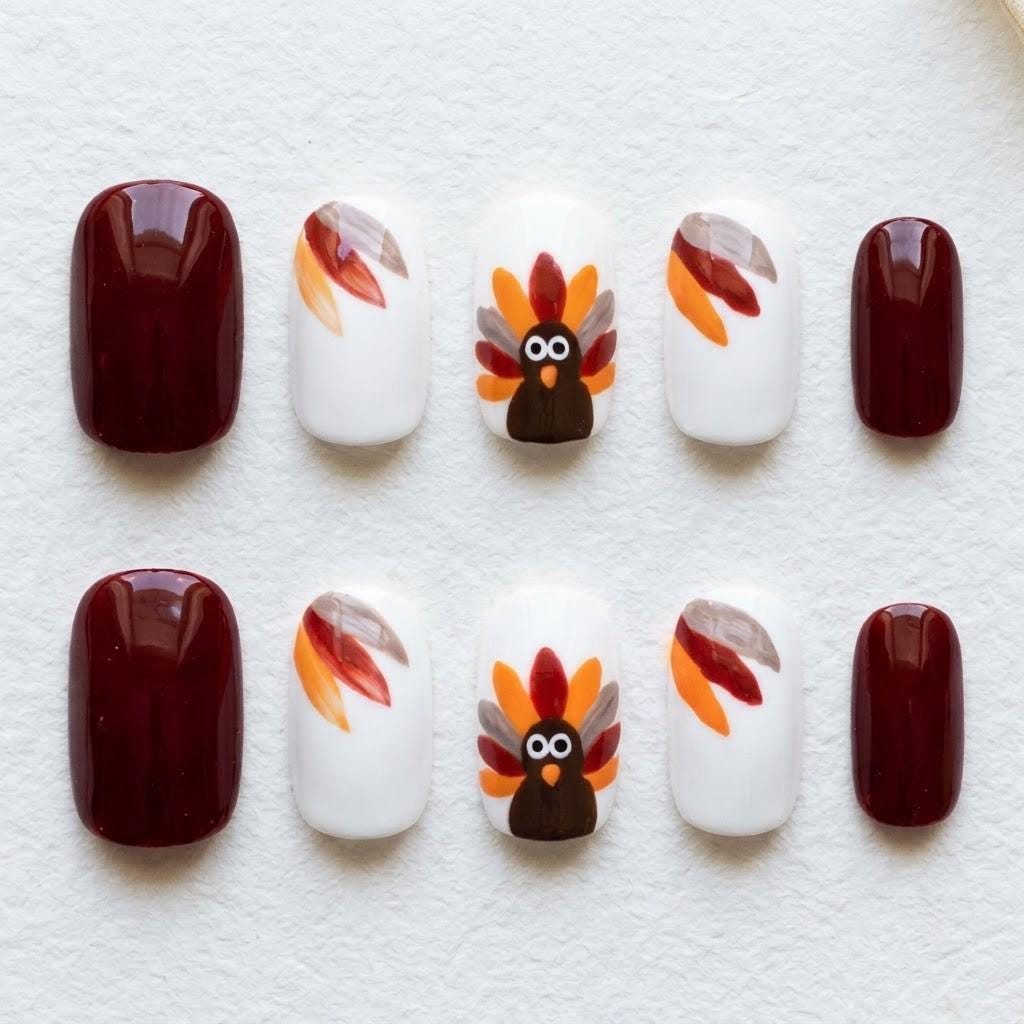 Thanksgiving Turkey Press On Nails in Burgundy, White, and Autumn Feather Colors