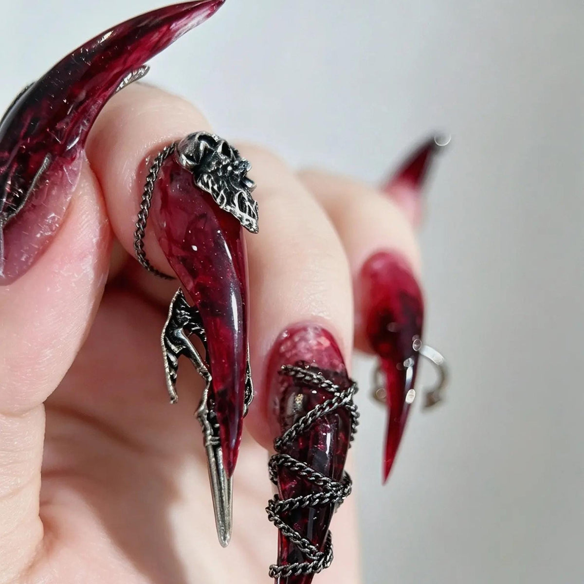 Translucent Burgundy Gothic Nails With Silver Chains and Raised Charms