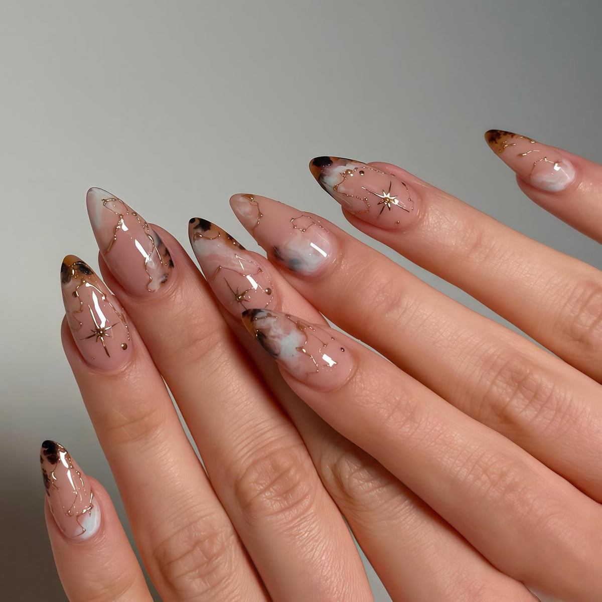 Translucent Pink Marble Nails with Gold Constellation Lines and Stars