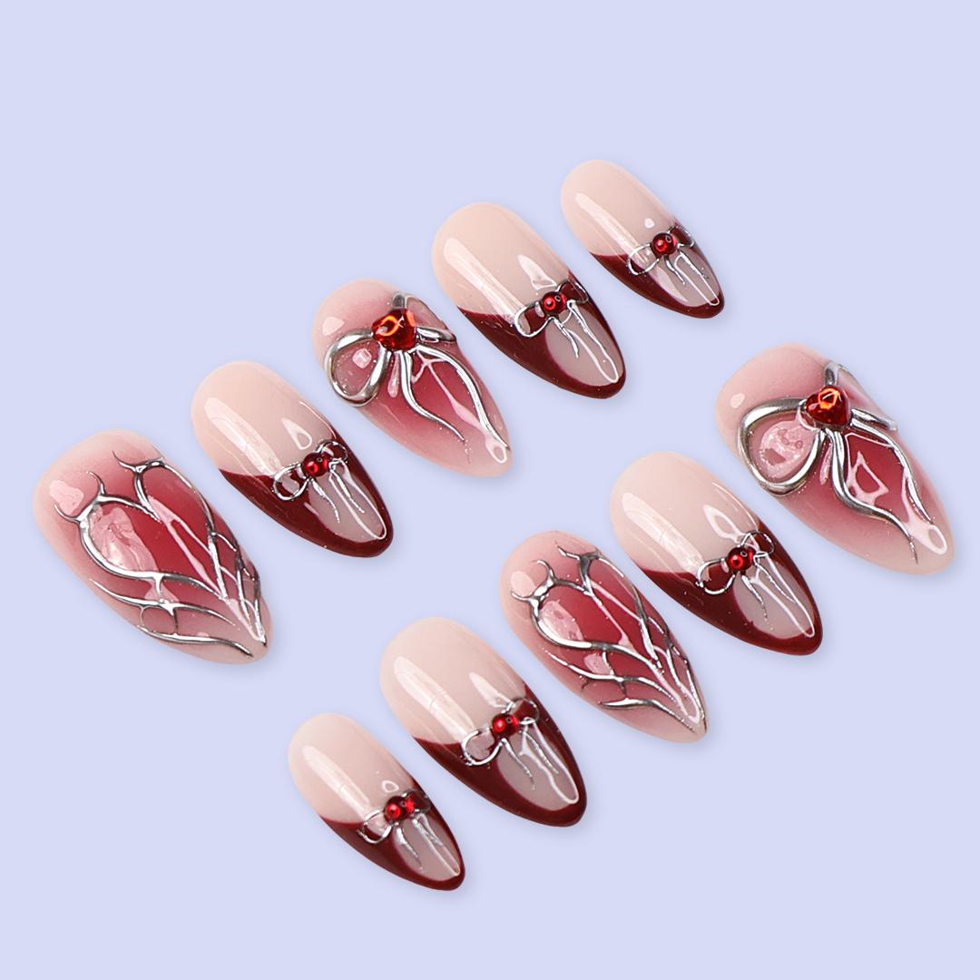 Valentine Nude Pink and Red French Tip Nails with Silver Bow and Heart Motifs