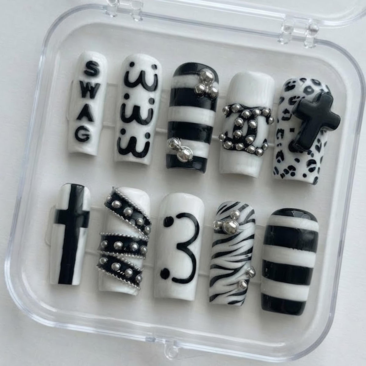 Y2K Black and White Animal Print Nails with Raised Crosses and Silver Chain Details