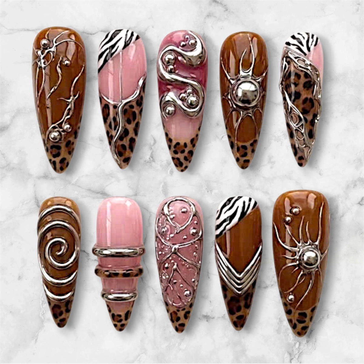 Y2K Cyberpunk Brown Leopard and Zebra Print Nails with Pink and Silver Sculptural Details