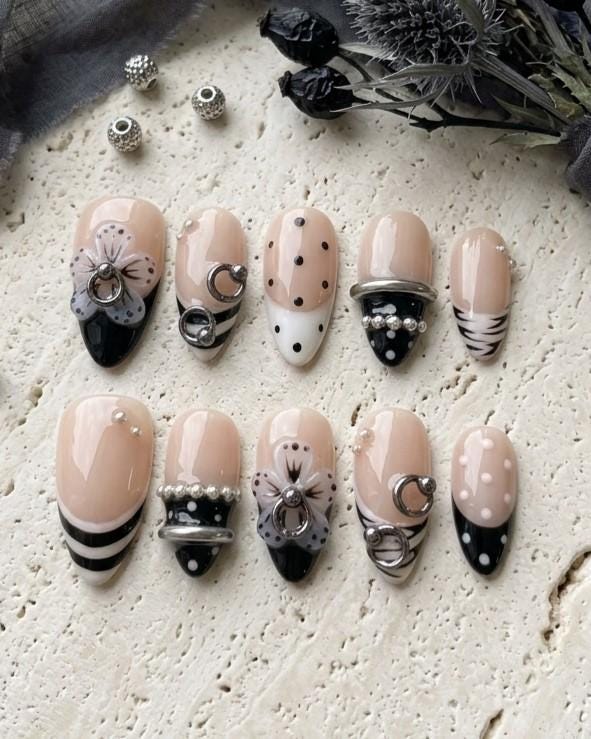 Y2K Grunge Nude Pink and Black 3D Flower Nails with Silver Rings and Pearl Accents