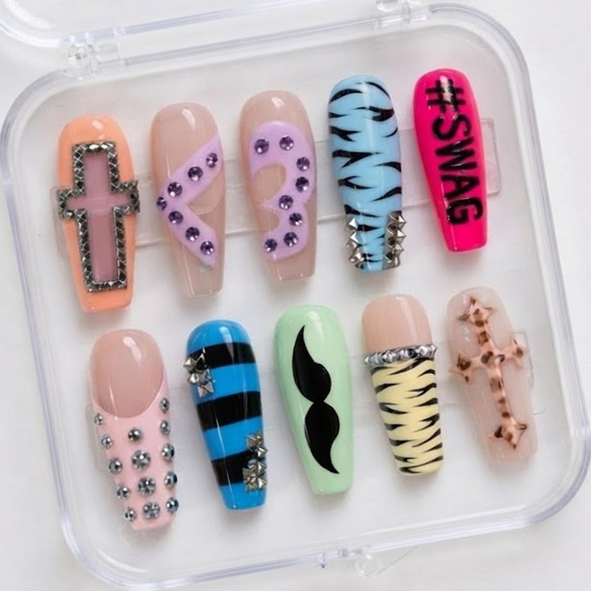 Y2K Scene Nails With Zebra Print, Rhinestone Crosses, and Neon Details